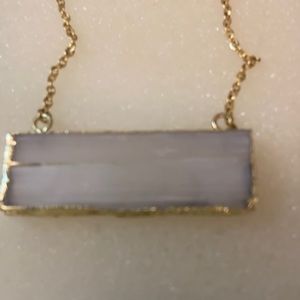Quartz necklace it comes in a box all ready for a give